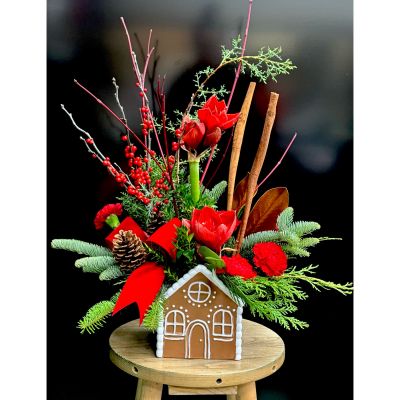 Fortin Gage Nashua - A sweet treat for the holidays! This ceramic gingerbread house is filled with long lasting winter greens, cinnamon, dogwood and red amarylis and carnations. Want roses instead of carnations? Select the rose option! 
