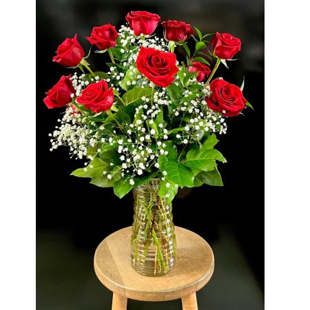 Fortin Gage Nashua - A lush and abundant arrangement of one dozen, long-stemmed premium red roses, expertly accented with delicate babies breath and rich greenery in a classic glass vase. 
