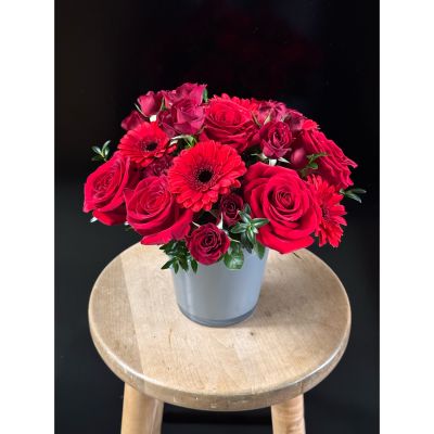 Fortin Gage Nashua - A gorgeous pairing of red roses and mini gerbera daises with a little touch of spray roses. 
