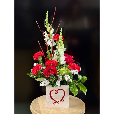Fortin Gage Nashua - A traditional red and white arrangement in a wooden cube lined and filled with Cupids favorite flowers. 