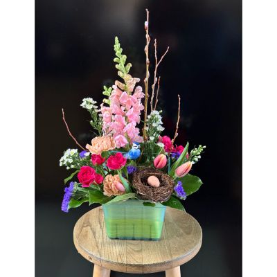 Fortin Gage Nashua - A signs of spring unique arrangement in a berry basket! Featuring a spring bird, nest with egg, tulips and pussy willows. 