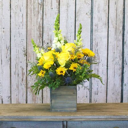 Madison Avenue Florist Sacramento - Bask in the radiant glow of a Sunshine Meadow, a cheerful bouquet featuring yellow roses and yellow daisies. This bright and sunny arrangement is designed to bring warmth and joy to the recipient. With our same-day flower delivery, you can effortlessly send the Sunshine Meadow and let the vibrant beauty of yellow blooms brighten someone's day promptly. Whether it's to express happiness, send well wishes, or simply spread sunshine, this bouquet is a delightful choice for various occasions. Let the refreshing and lively hues of yellow roses and daisies convey your positive sentiments in a thoughtful and uplifting way.





