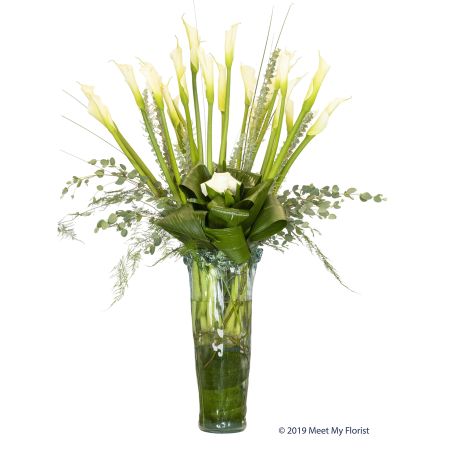 Madison Avenue Florist Sacramento - Experience the stunning, elegant, and unique beauty of "Over the Top." This one-of-a-kind arrangement features a case imported from Spain filled with Calla Lilies, curly willow, and other beautiful blooms. It's a luxurious and eye-catching display that is sure to leave a lasting impression. With our same-day flower delivery, you can effortlessly send "Over the Top," allowing the recipient to enjoy the extravagant beauty of this arrangement promptly. Whether it's a special celebration, an extraordinary gesture, or simply an expression of admiration, this arrangement is designed to captivate and enchant with its exceptional floral design.