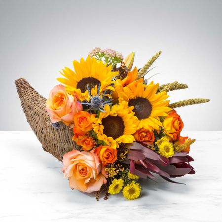 Madison Avenue Florist Sacramento - A traditional basket cornucopia filled with fall blooms! 