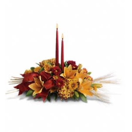 Madison Avenue Florist Sacramento - Elevate your Thanksgiving celebration with the Graceful Glow Centerpiece, a captivating arrangement that brings a radiant glow to the table. Delightful red roses, orange Asiatic lilies, and orange and bronze chrysanthemums, beautifully surround two elegant taper candles. The addition of burgundy ribbon and accents of natural wheat make this centerpiece wildly festive. Measuring approximately 26 inches, it creates an atmosphere of warmth and gratitude, making your Thanksgiving all the more special. With our same-day flower delivery, you can effortlessly bring this graceful centerpiece to your holiday table, leaving everyone filled with appreciation for the beauty it brings.





