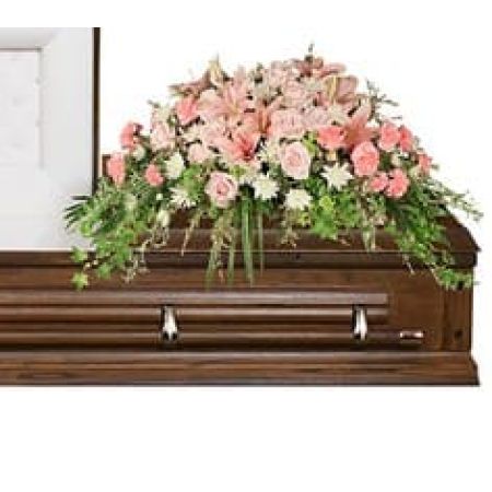Madison Avenue Florist Sacramento - Delicate  casket spray of roses, lilies and other pale pink florals for a gentle final farewell. Shown in an open lid size for viewing your loved one, full closed lid size is available