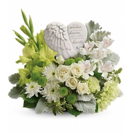 Flowers In Design Sacramento - "Hearts in Heaven" is a heartfelt and sympathetic expression of condolences. This majestic arrangement features white roses that serve as a symbol of purity and rejuvenation for the spirit. The centerpiece of the arrangement is a graceful angel's wing keepsake, etched with an encouraging message. The keepsake becomes a cherished memento that provides comfort and solace during difficult times. "Hearts in Heaven" is a thoughtful and meaningful tribute to honor and remember a loved one.