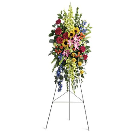 Orangevale Florist Sacramento - The "Love Lives On Spray" is a bold and vibrant tribute that fills the room with a spirit of hope and joy. This colorful spray features a beautiful array of flowers, including hot pink roses, yellow roses, orange spray roses, pink Asiatic lilies, green gladioli, green carnations, medium yellow sunflowers, blue delphinium, bupleurum, myrtle, sword fern, silver dollar eucalyptus, and lemon leaf. Each bloom contributes to the overall celebration of a love that will live on forever. The combination of bright hues symbolizes the enduring spirit of the departed and brings comfort to those who are mourning.






