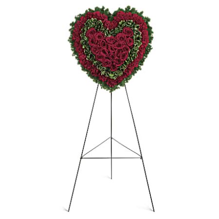 Orangevale Florist Sacramento - The Majestic Heart funeral display is a poignant and heartfelt expression of love and sympathy. Crafted with care, it features a combination of deep red roses and carnations, symbolizing enduring love and respect for the departed. The arrangement is enhanced with variegated pittosporum and ming fern, adding a touch of greenery that represents hope and renewal. This majestic display is more than a floral arrangement; it's a beautiful tribute that speaks volumes about the profound emotions felt during this difficult time. Placed at the memorial service, it serves as a visual representation of the enduring love and cherished memories shared with the departed soul. 2 sizes available with color options