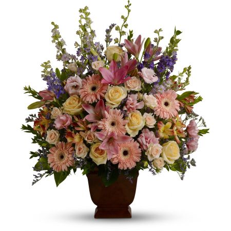 Madison Avenue Florist Sacramento - A warm and peaceful bounty of pastel blossoms gently expresses love and respect. A gracefully composed arrangement appropriate for home or service.