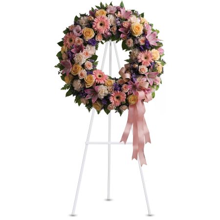 Orangevale Florist Sacramento - The Graceful Wreath is a gentle and timeless circle of fragrant blooms designed to celebrate sweet memories of a special loved one. Family and friends will find comfort in the elegant arrangement that serves as a beautiful tribute to the departed. The wreath features a thoughtful combination of flowers, offering solace and expressing sympathy during a time of loss. Its graceful design conveys a sense of peace and remembrance, providing a fitting way to honor the memory of a cherished individual. Available in 3 sizes, all wreaths are displayed on a provided easel





