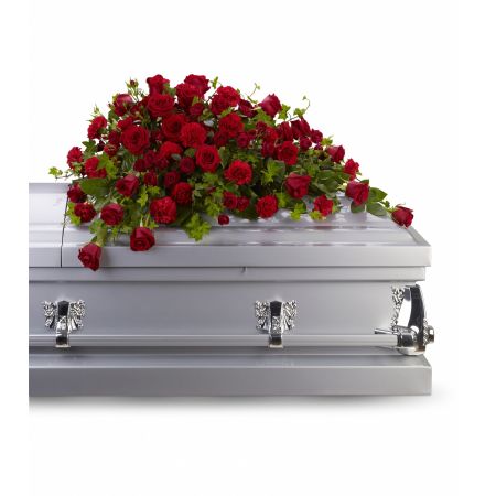 Flowers In Design Sacramento - Roses tell a story of love, beauty, and strength. This all-red floral design graces the casket with accents of trailing ivy, roses and carnations. This design shape is specifically designed for an open lid service. Available in One size only