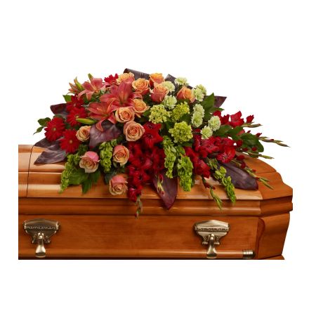 Flowers In Design Sacramento - An overflowing of love and respect is joyfully expressed in this truly magnificent casket spray of orange roses and lilies and other brilliant blooms. Shown here as a half casket for an open lid service. This can be designed for a closed lid service full size.