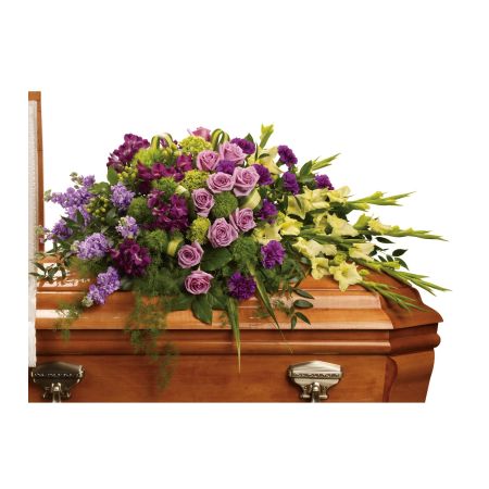Flowers In Design Sacramento - Devotion is beautifully expressed with lavender roses, purple alstroemeria and other favorites artistically arranged and placed on top of the casket. Designed as shown in a half casket for open viewing, this can be designed in a full casket for closed lid services. 