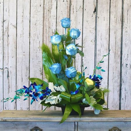Madison Avenue Florist Sacramento - Introducing the Blue Diamond, a truly unique and captivating arrangement featuring blue roses and blue orchids. This stunning bouquet is a rare and exquisite expression of beauty, designed to stand out and make a lasting impression. The combination of blue roses and orchids creates a striking visual impact, evoking a sense of elegance and mystery. With our same-day flower delivery, you can effortlessly send the Blue Diamond, allowing the recipient to experience the allure and sophistication of this extraordinary floral arrangement promptly. Make a bold and stylish statement with this distinctive bouquet that showcases the rare beauty of blue blooms.





