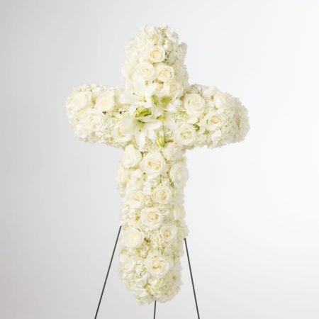 Orangevale Florist Sacramento - An all white tribute, this white cross funeral spray is pure and tranquil. Featuring a variety of white carnations & cushion mumsflowers, this elegant easel compliments the beauty of life.