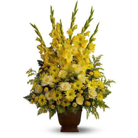 Madison Avenue Florist Sacramento - Honor a bright spirit who was like a ray of sunshine to everyone they encountered, with a grand display of bold yellow blossoms. At more than three feet tall, it will add a touch of brightness to any tribute.