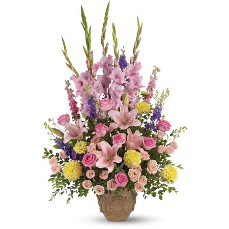 Orangevale Florist Sacramento - Not at all somber are these abundant blooms of pink, yellow and lavender, gracefully arranged in a container that is equally suitable for a memorial service or one's home.