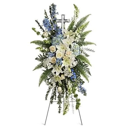 Orangevale Florist Sacramento - A touching display of devotion, this peaceful spray of white and light blue flowers is accompanied by an elegant GENUINE  crystal cross keepsake that will be cherished for years to come.