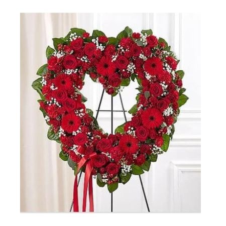 Conroy's Florist & Flower Delivery Mission Viejo - The love for someone who has passed away lives on forever in the hearts of those left behind. This sentiment is best captured with our standing, open heart-shaped red floral arrangement. Handcrafted by our caring florists with an assortment of radiant red blooms, it is a magnificent tribute fitting for the funeral services.

All-red open heart-shaped arrangement of roses, spray roses, Gerbera daisies, carnations, mini carnations, hypericum; accented with baby's breath and soft, lush greenery
Arrangement is designed on an easel and accented with satin ribbon
Measures approximately 26&#34;H x 28&#34;W without easel
Appropriate for the funeral home
Our florists use only the freshest flowers available, so colors and varieties may vary