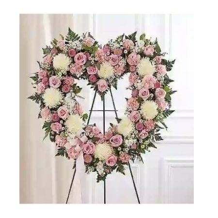 Conroy's Florist & Flower Delivery Mission Viejo - They will always hold a special place in your heart. This sentiment is best captured with our standing, open heart-shaped arrangement in pink hues. Handcrafted by our caring florists with an assortment of graceful pink blooms, it is a magnificent tribute fitting for the funeral services.

Open, heart-shaped arrangement of pink roses, matsumoto asters and carnations; white football mums, stock and monte casino; accented with baby's breath and soft, lush greenery
Arrangement is designed on an easel and accented with satin ribbon
Measures approximately 26&#34;H x 28&#34;W without easel
Appropriate for the funeral home
Our florists use only the freshest flowers available, so colors and varieties may vary