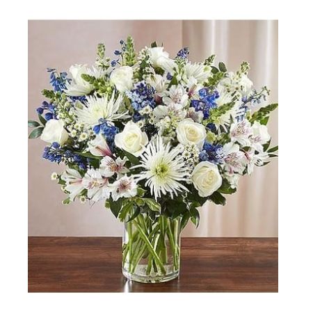 Conroy's Florist & Flower Delivery Mission Viejo - A sincerity of sentiment means so much to those grieving. Our bountiful, heavenly blue and white bouquet features a soothing mix of blue delphinium, alstroemeria, and white roses, hand-designed inside a classic clear glass vase. When sent to a service or to the home of family or friends, it makes a genuinely heartwarming gesture.
