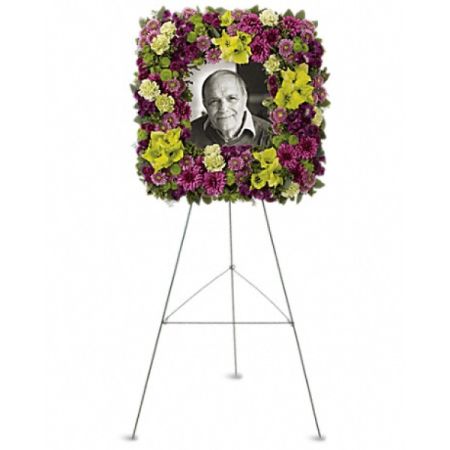 Conroy's Florist & Flower Delivery Mission Viejo - This striking square easel wreath, featuring a combination of purple and green flowers, serves as a beautiful and distinctive homage to an exceptional individual whose life has spread joy to countless hearts.