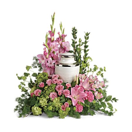 Conroy's Florist & Flower Delivery Mission Viejo - This lovely arrangement comprises miniature green hydrangea, pink spray roses, pink asiatic lilies, pink alstroemeria, pink gladioli, pink carnations, green carnations, bupleurum, green ivy, myrtle, ming fern, and lemon leaf. Please note that the arrangement does not include an urn. It measures approximately 27" in width and 26" in height.

Envelop the cremation urn with these stunning, elegant pink blossoms as a heartfelt expression of profound gratitude for a beautiful life.