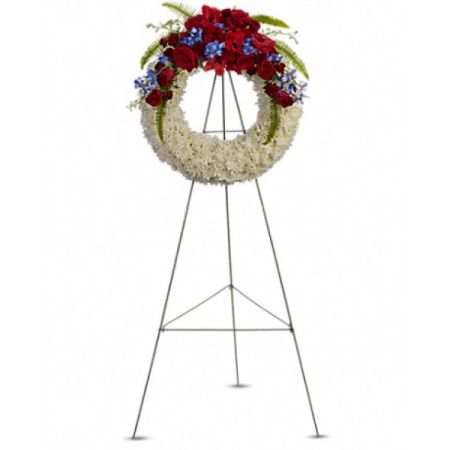 Conroy's Florist & Flower Delivery Mission Viejo - An elegant funeral wreath crafted with pure white blooms, symbolizing reverence and peace, is adorned with traditional red, white, and blue blossoms to honor a life of patriotism and service. This wreath serves as a heartfelt tribute, blending serene beauty with a deep sense of respect and remembrance, offering solace during a difficult time of loss