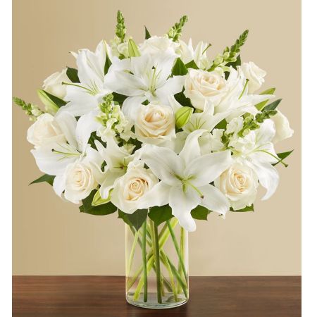 Conroy's Florist & Flower Delivery Mission Viejo - White flowers have a timelessness and elegance that brings comfort during life’s difficult moments. Hand-gathered by our caring florists with touches of lush greenery, this classic arrangement beautifully conveys your heartfelt condolences.