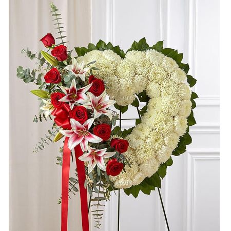 Conroy's Florist & Flower Delivery Mission Viejo - The passing of someone we love deeply requires a special tribute. Our open heart standing arrangement of fresh white blooms, accented by red roses and Stargazer lilies cascading down one side and adorned with a red satin ribbon, will help you express the devotion and sympathy in your heart.