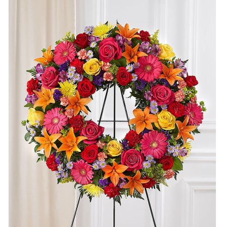 Conroy's Florist & Flower Delivery Mission Viejo - Representing the circle of eternal life, a wreath is a fitting way to honor one whose vivacious spirit will live forever in our memories. Our bright standing wreath arrangement, artistically handcrafted by our expert local florists with a colorful mix of blooms for a lush, full presentation, creates an exquisite tribute for the funeral or memorial service.