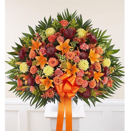 Conroy's Florist & Flower Delivery Mission Viejo - EXCLUSIVE The loss of a loved one is never easy, but a caring gesture can provide comfort and hope. Our classic standing basket arrangement is crafted by local florists with an abundance of blooms in rich, autumn colors. It’s a touching tribute to remind family and friends that brighter days are ahead.