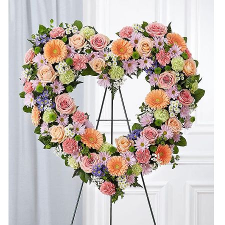 Conroy's Florist & Flower Delivery Mission Viejo - The warm and gentle love they showed to those around them will keep them always remembered. This sentiment is best captured with our standing, open heart-shaped arrangement in pastel hues. Handcrafted by our caring florists with an assortment of soft, pastel blooms, it is a magnificent tribute fitting for the funeral services.