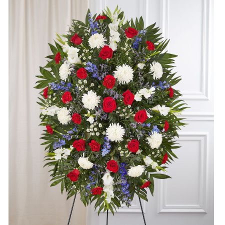 Conroy's Florist & Flower Delivery Mission Viejo - They served their country with honor and pride, which is how they should be remembered. Our patriotic standing spray arrangement is meticulously handcrafted by our expert florists to honor a brave veteran who has passed away. Filled with fresh blooms in red, white and blue for a lush, full presentation, it’s a proud and fitting final tribute.