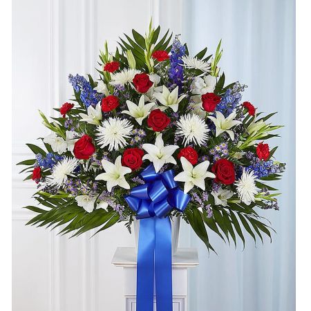 Conroy's Florist & Flower Delivery Mission Viejo - The love they showed for their country is as deep as the love felt by those mourning their loss. Meticulously crafted by our expert florists to honor a proud veteran who has passed away, our majestic standing basket arrangement is filled with lush blooms in patriotic red, white and blue, creating a fitting final tribute for the funeral services.