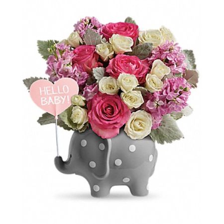 Conroy's Florist & Flower Delivery Mission Viejo - A charming celebration of a new baby girl's arrival. This exquisite arrangement features a delightful baby elephant, surrounded by bright pink roses, white spray roses, and pink stock. Designed to enchant and inspire, it's perfect for creating whimsical visuals in a newborn's imagination. Ideal for those searching for the perfect gift to welcome a sweet little girl, this floral arrangement blends beauty with the joy of new beginnings.