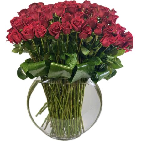 Conroy's Florist & Flower Delivery Mission Viejo - "Enchantin Bouquet" is a mesmerizing arrangement featuring 100 premium red roses, thoughtfully curated to evoke a sense of timeless elegance. The lush scarlet blooms are expertly arranged in a fish-eye pillow vase, creating a stunning visual impact. This breathtaking bouquet captures the essence of passion and romance, making it a perfect gift to express deep emotions or commemorate a special occasion. The rich, velvety red tones combined with the unique vase design create a truly enchanting floral masterpiece that will leave a lasting impression.