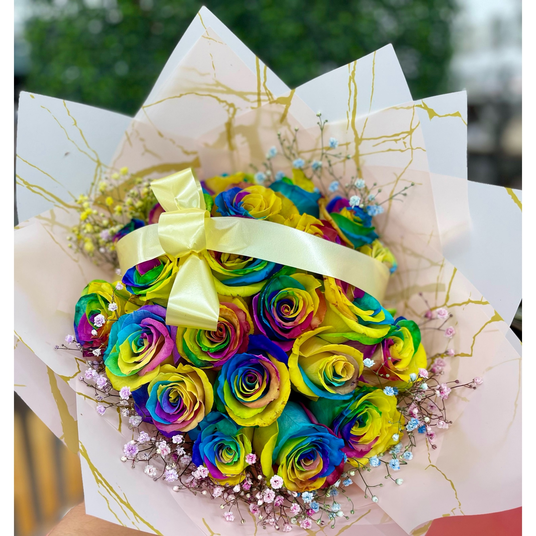 Conroy's Flowers Cypress Cypress - Immerse yourself in a spectrum of beauty with our  Rose Bouquet in a stunning rainbow of colors. Each  rose is meticulously wrapped in our most luxurious paper, and adorned with careful decorations to create an everlasting impression that captivates anyone who lays eyes on this beautiful piece. For an even grander gesture, consider upgrading to Deluxe and receiving twice the size with an impressive 24 stems! This generous and vibrant bouquet is sure to make a statement, adding a burst of color and joy to any occasion. Take advantage of our same-day flower delivery to ensure that this radiant collection of roses brightens someone's day promptly. Revel in the kaleidoscope of colors and express your sentiments in the most vibrant way possible.





