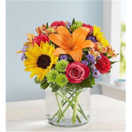 Petal and Leaf (Formerly Conroys's Flowers Cypress) Cypress - About Floral Embrace™
Like a warm embrace, our vibrant flower bouquet delivers your sentiments to someone special. A rich gathering of yellow and orange blooms, with pops of bright pink and purple, it's more than a gift… it's a way to express how you feel. 

**Flowers and vase my vary based on availabity. We will preserve the color palette and theme of the design

