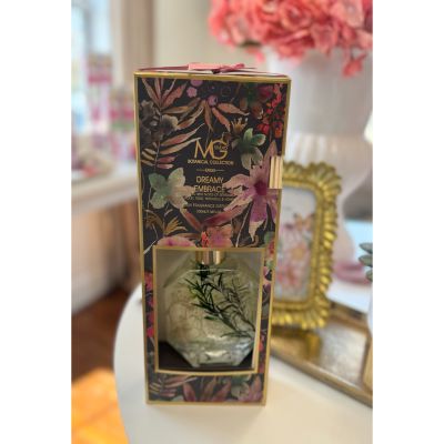 Tom's Florist Smyrna - Surround yourself—or someone special—in the soft, romantic scent of Dreamy Embrace. This elegant reed diffuser features a beautifully balanced blend of bergamot, violet, rose, patchouli, and a touch of honey, creating a warm and inviting ambiance that lingers gently in the air.

With its sleek design and long-lasting fragrance, Dreamy Embrace makes a thoughtful standalone gift, or the perfect add-on to a floral arrangement or curated gift box.

Ideal for bedrooms, bathrooms, entryways, or anywhere you want to infuse with calm and beauty—no flame or plug needed.

Gift tranquility. Add elegance. Let the scent of Dreamy Embrace do the rest.