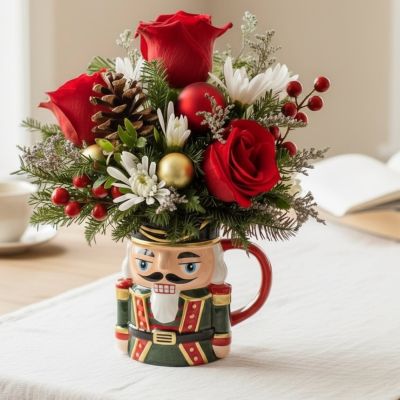 Tom's Florist Smyrna - Celebrate the season with the perfect blend of holiday cheer and floral beauty!
Each arrangement is artfully designed with festive blooms and greenery, nestled in a charming Christmas mug — ready to brighten any table, desk, or gift exchange.


Perfect for gifting, decorating, or adding cozy charm to any space.

Please note: Mugs may vary in style and design, making each arrangement a one-of-a-kind holiday treasure.

Approximately 6 inches tall
Features a reusable ceramic Christmas mug