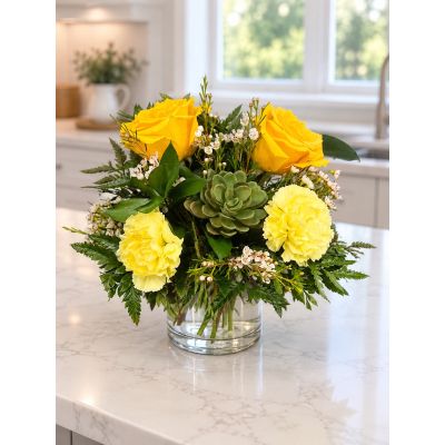 Tom's Florist Smyrna - A dainty yellow arrangement with a fresh green succulent.