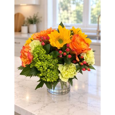 Tom's Florist Smyrna - A stunning arrangement of rich yellows and oranges. 