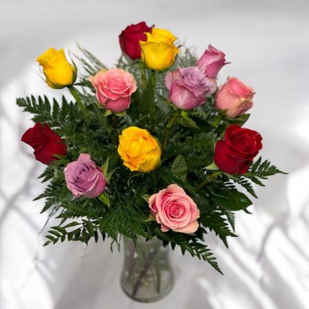 Tom's Florist Smyrna - A beautiful bouquet of one dozen premium roses in a vibrant mix of colors — hand-selected by our floral designers based on seasonal availability. Each arrangement is unique, featuring a blend of assorted hues for a stunning and cheerful display.

Perfect for birthdays, anniversaries, or simply to brighten someone’s day, this bouquet is a joyful expression of love, appreciation, and celebration.

Please Note: The photos shown are examples only. The exact color combination will vary based on the freshest roses available at the time of your order.