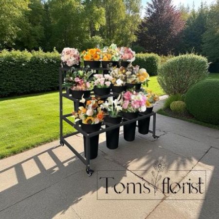 Tom's Florist Smyrna - Tom’s Florist offers two types of flower cart/flower bar options. 

Hostess style: This style is ideal for a get-together, shower event or birthday party where everyone gets to put together a bouquet as an activity or as a gift to take home! Our pricing includes: flowers, greens, accents, wraps, scissors, etc.

The whole cart is paid for by a host for a set price and then guests can make their own arrangements. We offer this in $200,$300, $450 and $600 increments.

Pop-Up style: Is your business having an event and you are looking for other small businesses to collaborate with? We may be a perfect fit! We bring the cart, take our own payment and bring everything to add fresh blooms to the event!

Flowers are priced by-the-stem and customers can make their own arrangements and pay. It includes wraps for each customer to take home their bouquet.

Cart rental is based off a 4 hour rental. 


