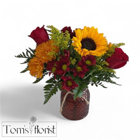 Tom's Florist Smyrna - Vibrant, warm, and full of joy.
the passionate beauty of red with the sunny charm of yellow to create a bold and uplifting display.  This bouquet is perfect for celebrations, or a simple Thank-you gesture.