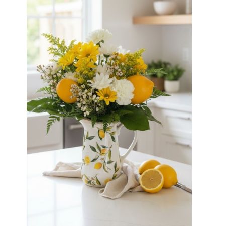 Tom's Florist Smyrna - This charming arrangement brings a fresh, cheerful touch to any space. Designed with a natural feel, it has beautifully relaxed look. The lush greenery adds fullness and texture white the delicate blooms create a inviting presentation. Feeling both elegant and whimsical this arrangement is perfect for brightening someone's day, celebrating a special moment or simply bringing a little beauty into a home. 