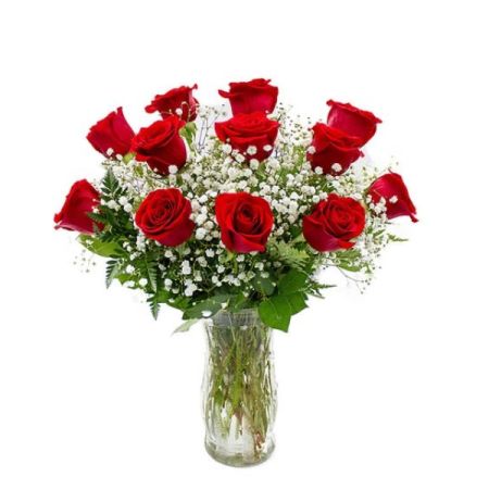 Tom's Florist Smyrna - Classic. Romantic. Timeless. This elegant arrangement features one dozen premium red roses accented with delicate baby’s breath and lush greenery, all beautifully arranged in a clear glass vase.

Perfect for anniversaries, Valentine’s Day, or any heartfelt occasion, this bouquet is a stunning expression of love and admiration.

Includes vase and baby’s breath.