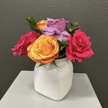 Conroy's Flowers San Diego San Diego - A vibrant mix of pink, orange, and lavender roses in a sleek white vase—simple, bold, and perfectly charming for any space.

**Flowers and vase my vary based on availability. We will preserve the color palette and theme of the design.
